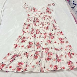 Long white floral dress, adjustable button straps with a built in bra.